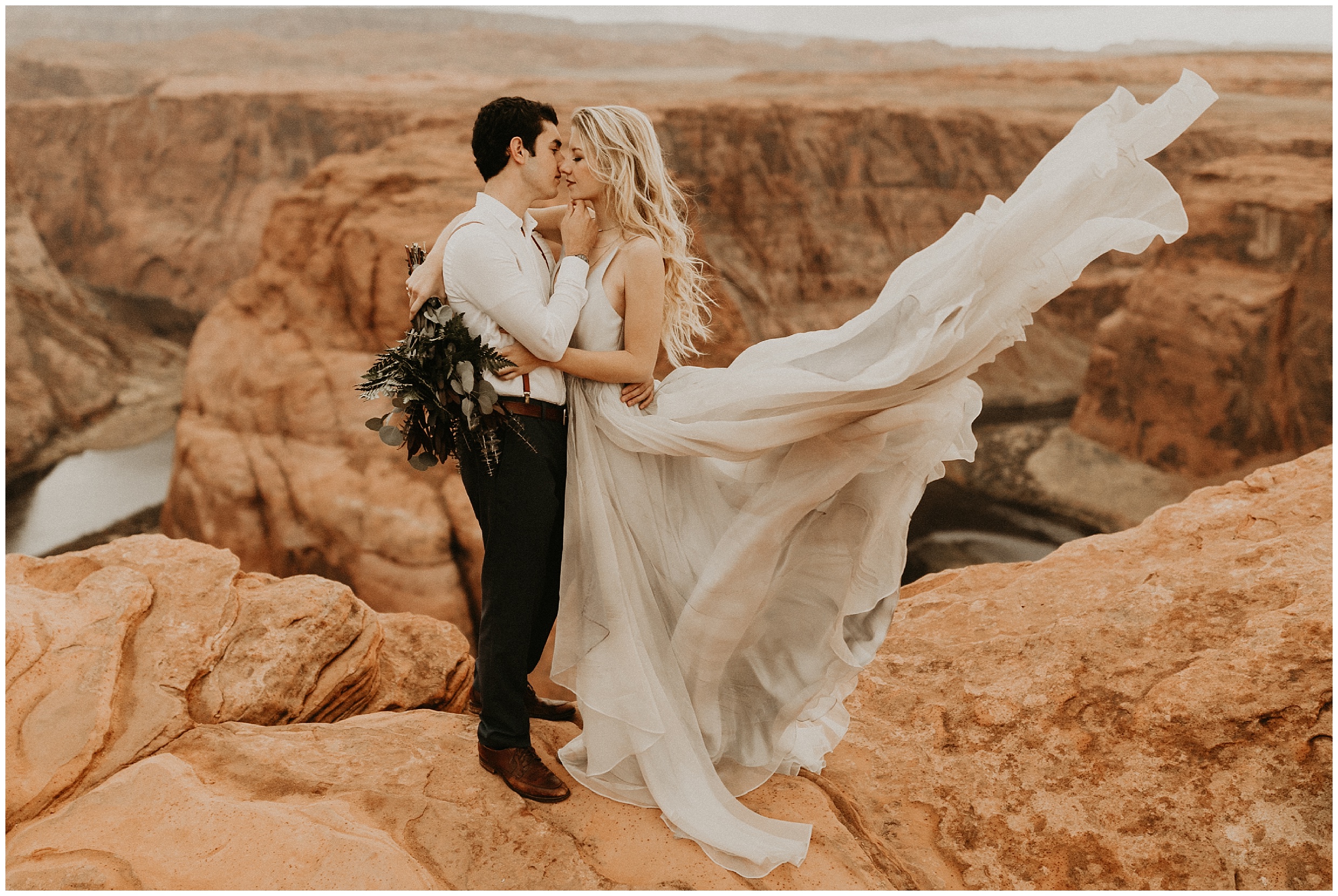Adventurous windswept bride and groom photos at Horseshoe Bend