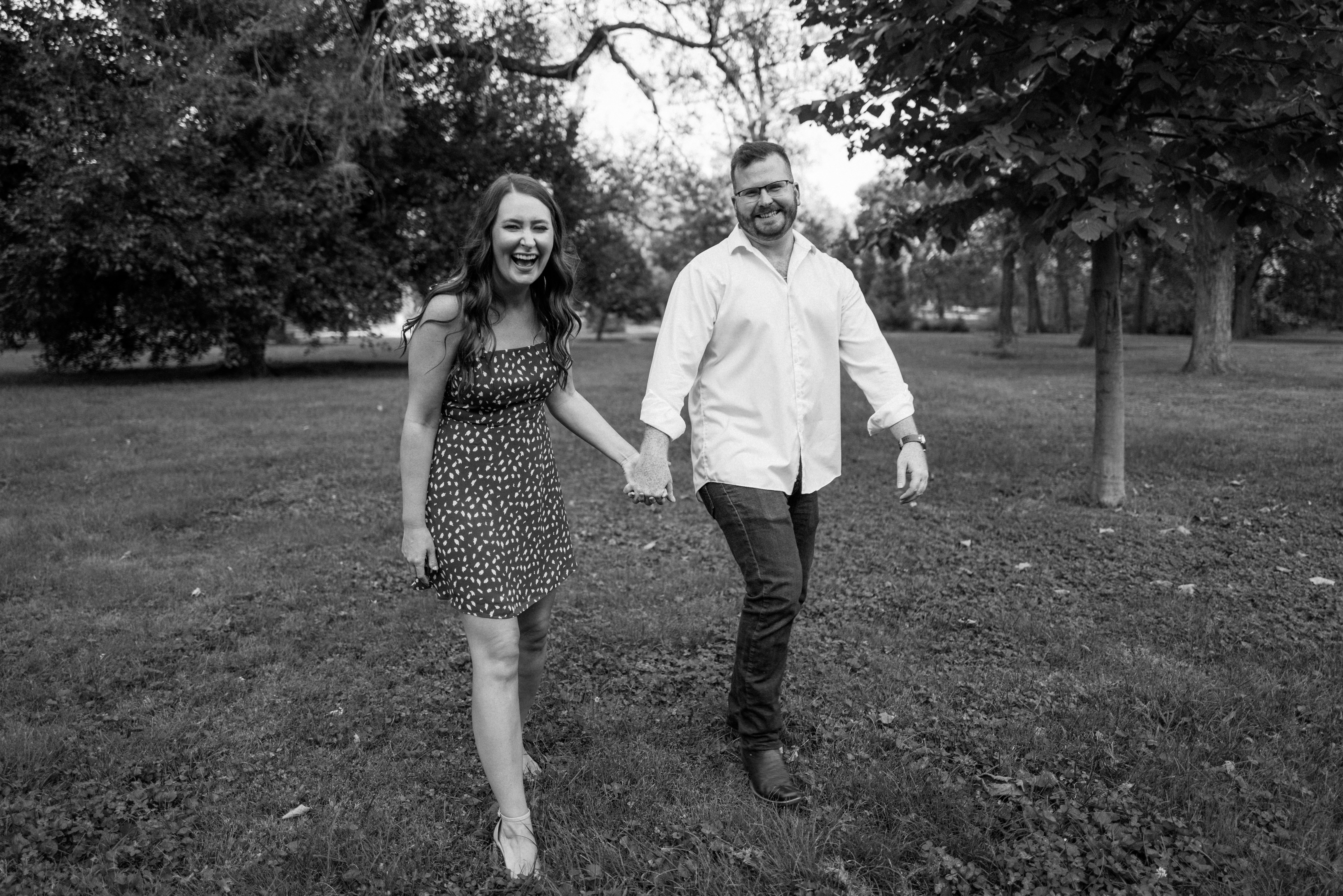 Engagement session in Tower Grove Park, St. Louis. Couple photos in a dress outfit with their German shepherd dog. Engagement photos with dogs are the best!